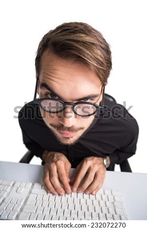 Portrait of a smiling businessman using computer on white background