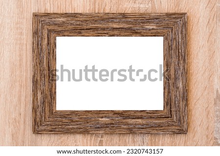Blank wooden picture frame on the wood background.Copy space.