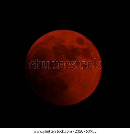 This is a picture of the moon overlapping a total lunar eclipse and a celestial cover, taken on November 8, 2022
