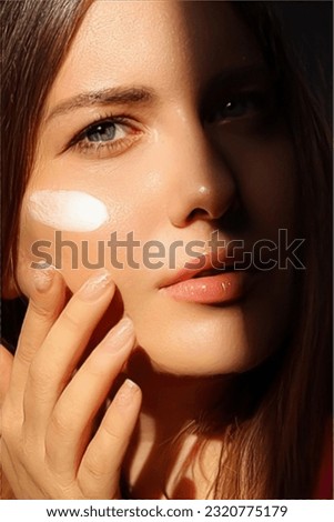 Beauty, suntan spf and skincare cosmetics model face portrait, woman with moisturising cream, sunscreen product or sun tan lotion on her cheek, luxury facial and skin care ad Royalty-Free Stock Photo #2320775179