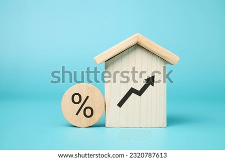 Wooden block with signs and symbols of percentage and arrow up
