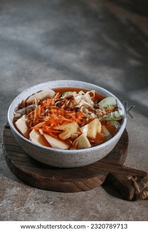 Asinan is a pickled (through brined or vinegared) fruit or vegetable dish. Usually served with peanut, sambal and kerupuk. The most popular in Indonesia are asinan Betawi and asinan Bogor