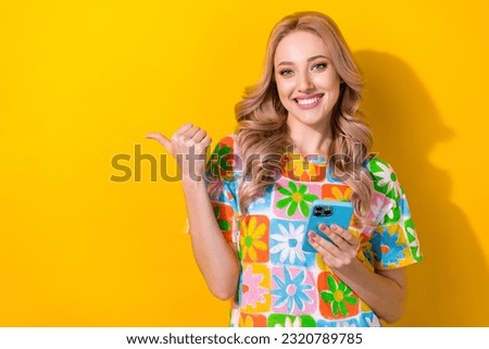 Photo of confident agent lady use new model iphone smartphone direct empty space commercial isolated yellow color background