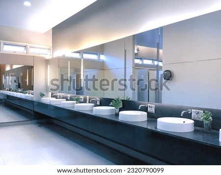 Bathroom sink. Public bathroom sink. 
 Royalty-Free Stock Photo #2320790099