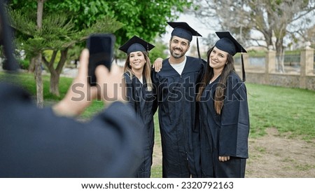 Group of people students graduated taking photo by smartphone at university campus