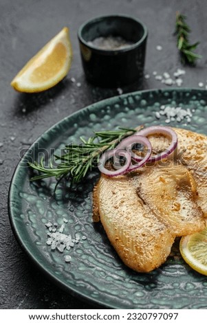 Baked white fish fillet tilapia or pangasius. vertical image. top view. place for text,