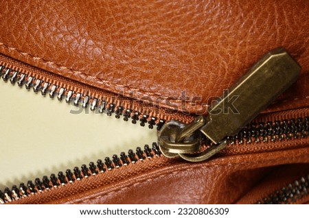 notepad with space for your text, open lock on leather bag reveal secret Zipper isolated on white background with clipping path communication issues