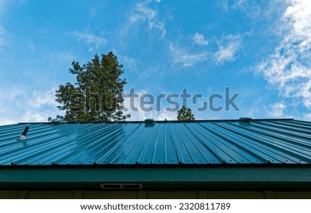 Upward view of a standing seam metal roof  Royalty-Free Stock Photo #2320811789