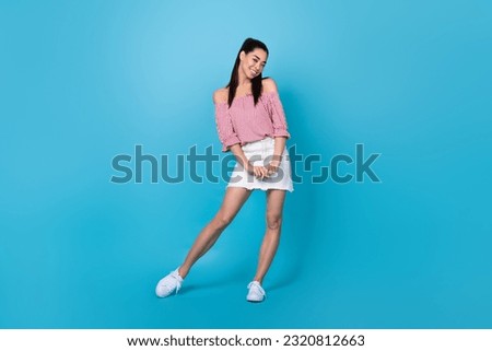 Full size cadre of japanese woman stay positive preppy model posing good mood glamour trend outfit isolated on blue color background