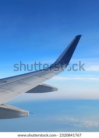 A piece of airplane's wing. It is just a regular picture that I took every time I am in a flight. It reminds me of my journey to places around the world.
