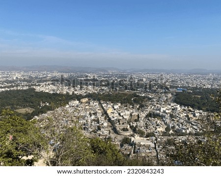 Beautiful Udaipur City view from Mansapurna Karni Mata Temple. We reach there by ropeway. Royalty-Free Stock Photo #2320843243