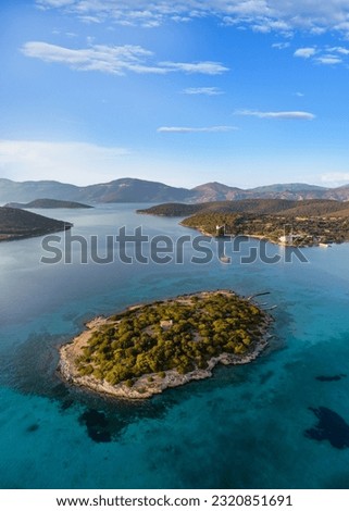 Petal Islands, group of islands off Evia. Podikoniso Islet Royalty-Free Stock Photo #2320851691