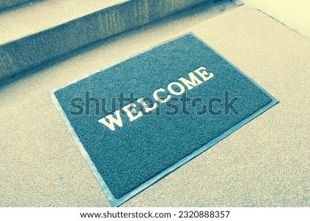 Welcome carpet on floor in luxury hotel,front of door home or restaurant .
