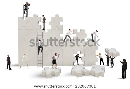 Business team Builds a new company with puzzle Royalty-Free Stock Photo #232089301