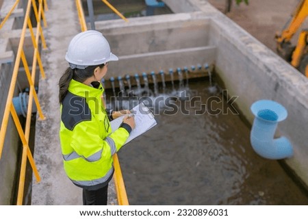 Environmental engineers work at wastewater treatment plants,Water supply engineering working at Water recycling plant for reuse,Check the amount of chlorine in the water to be within the criteria. Royalty-Free Stock Photo #2320896031