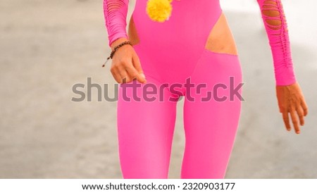 Young woman in a pink swimsuit, close-up image