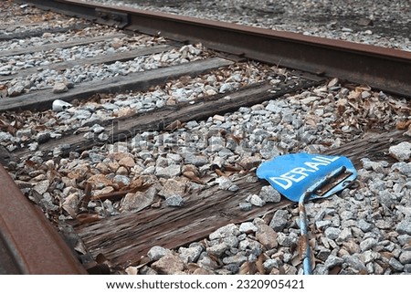 Blue Derailment Sign Knocked Over on Old Train Tracks.