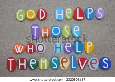 God helps those who help themselves, motivational quote composed with multi colored stone letters over green sand Royalty-Free Stock Photo #2320908687