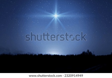 Christmas star. Background of the beautiful nite dark starry sky and bright star. Nativity of Bethlehem, Nativity of Jesus Christ.