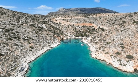 Aerial drone photo of beautiful secluded fjord shaped cove of Tourkopigado, Irakleia island, small Cyclades, Greece