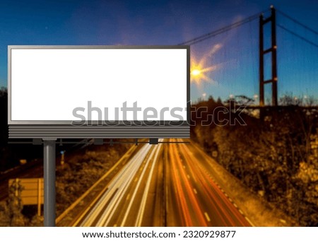 Blank billboard in front of highway suspension bridge view
