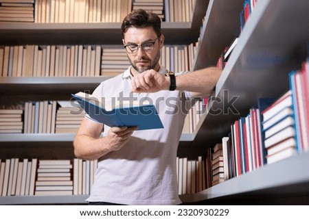 Portrait of professor with book in classroom. Handsome professor in library. Teachers Day. Good professor. Man professor with reading books in classroom. Knowledge education concept. Professors day.