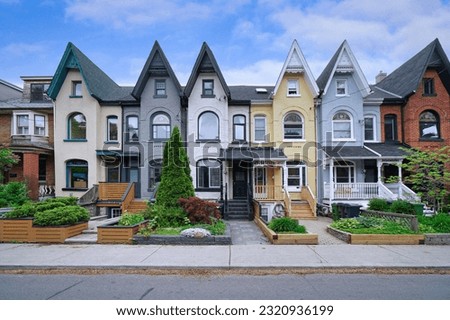 Narrow Victorian row houses with peaked gables Royalty-Free Stock Photo #2320936199