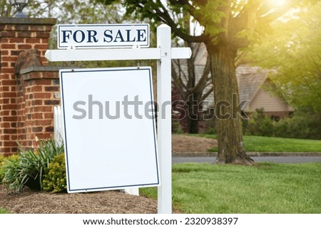 For Sale sign in front of home suitable for mock up. Real estate housing market - add your design