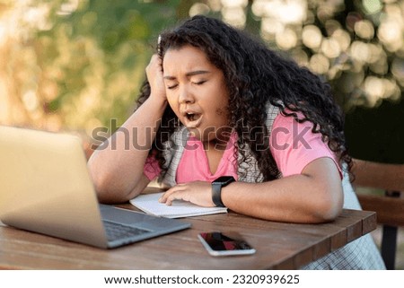 Boring E-Learning. Bored Hispanic Student Lady Yawning Sitting At Laptop During Online Studies Outdoors, Side View Shot. Sleepy Learner Posing Tired Of Uninteresting Lessons At Computer