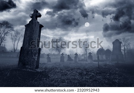 Old creepy graveyard on stormy winter day in black and white Royalty-Free Stock Photo #2320952943