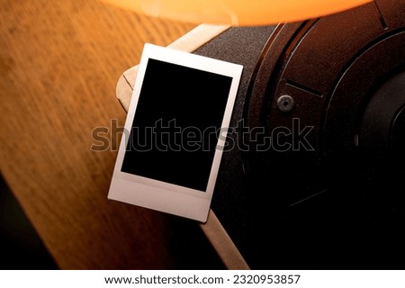 photo polaroid frames mockup on the wooden table Royalty-Free Stock Photo #2320953857