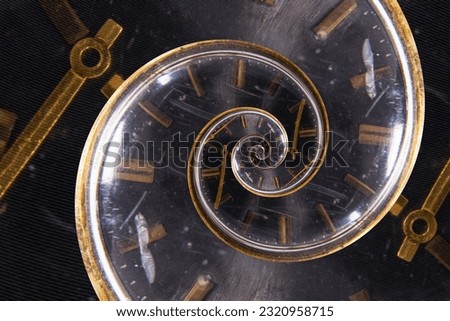 A retro analog clock spiraling into itself Royalty-Free Stock Photo #2320958715