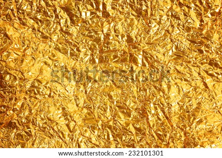 Shiny yellow leaf gold foil texture background Royalty-Free Stock Photo #232101301