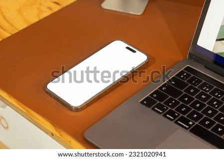 mobile phone with password page on working desk and leather sofa