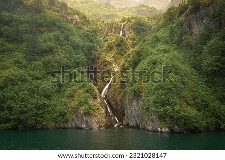 Waterfalls in Cataract Cove, Kenai Fjords National Park, near Seward, Alaska. Royalty-Free Stock Photo #2321028147