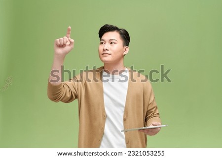 Pushing finger and a tablet, isolated. Royalty-Free Stock Photo #2321053255