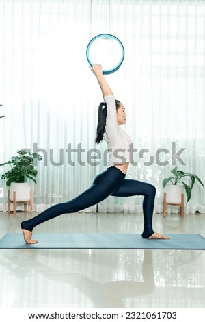 Yoga female teacher exercise work out on mat indoor yoga studio