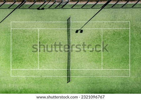 A tennis court is the venue where the sport of tennis is played. It is a firm rectangular surface with a low net stretched across the centre