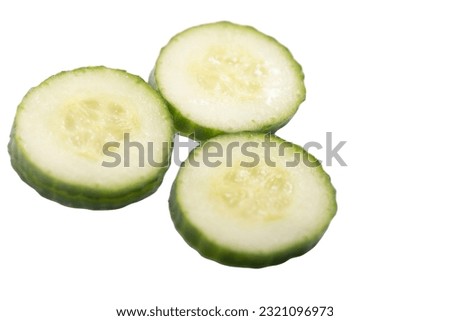Homemade chopped cucumber.Fresh organic cucumber isolated on white background. File contains clipping path. Full depth of field.,