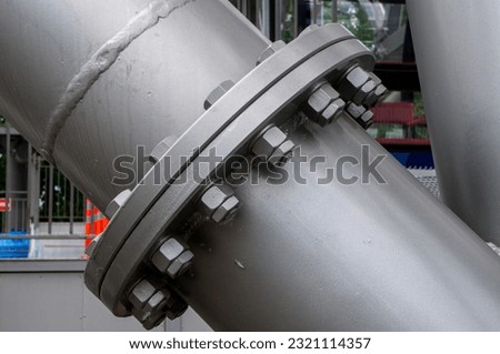 Connection of large round metal pipes Royalty-Free Stock Photo #2321114357