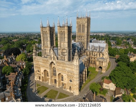 drone view Arial perspective Lincoln cathedral morning light stunning towers large medieval architecture west face sitting on hill overlooking historic city evening summer Royalty-Free Stock Photo #2321126835