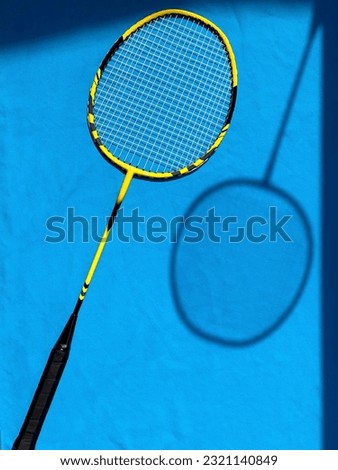 Rackets for badminton on a bright sunny day. View from above, drawing shadows