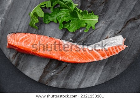 fresh salmon raw piece of fish seafood healthy meal food snack on the table copy space food background rustic top view pescatarian diet Royalty-Free Stock Photo #2321153181