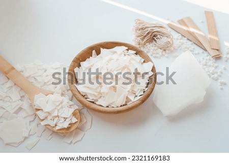 Set for crafting candle on white background. Eco soy wax and candle making tools top view, flat lay. DIY candles. Hobby concept. Royalty-Free Stock Photo #2321169183