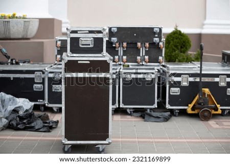 Case boxes for musical equipment. Professional stage equipment is packed in special boxes. Royalty-Free Stock Photo #2321169899