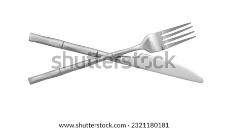 Knife and fork isolated on white, top view. Stylish shiny cutlery set Royalty-Free Stock Photo #2321180181