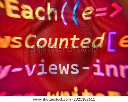 Digital technology on display. Shallow depth of field, selective focus effect. Monitor photo. HTML code on the screen editor, dark screen. Mobile app building. Hacker background