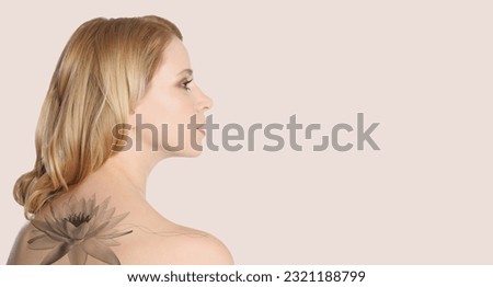 Young woman with beautiful flower tattoo on light background, space for text. Banner design