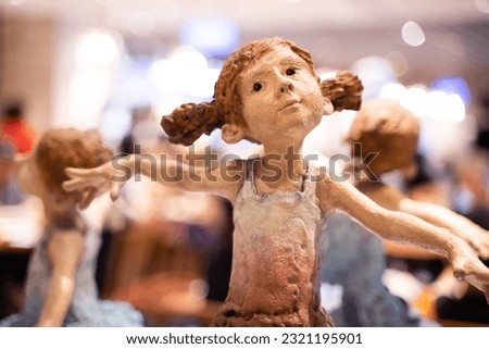 Plaster doll of a ballet girl ,Bokeh light background , home decoration ideas.