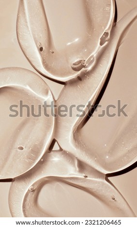 texture gel serum on beige background Royalty-Free Stock Photo #2321206465